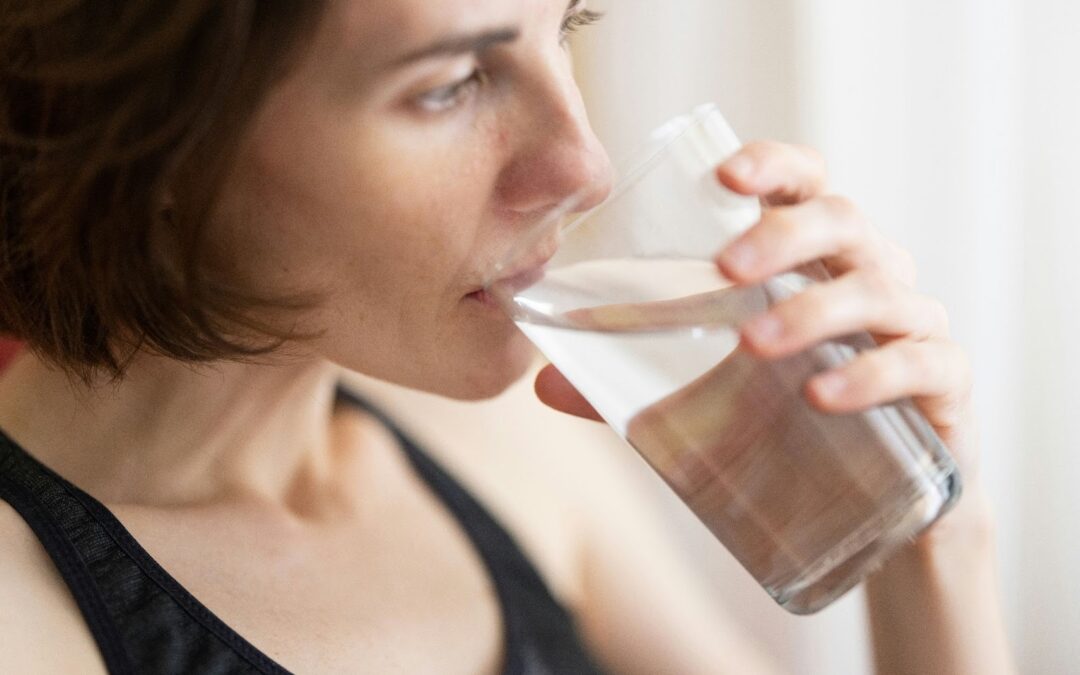 woman drinking glass of water